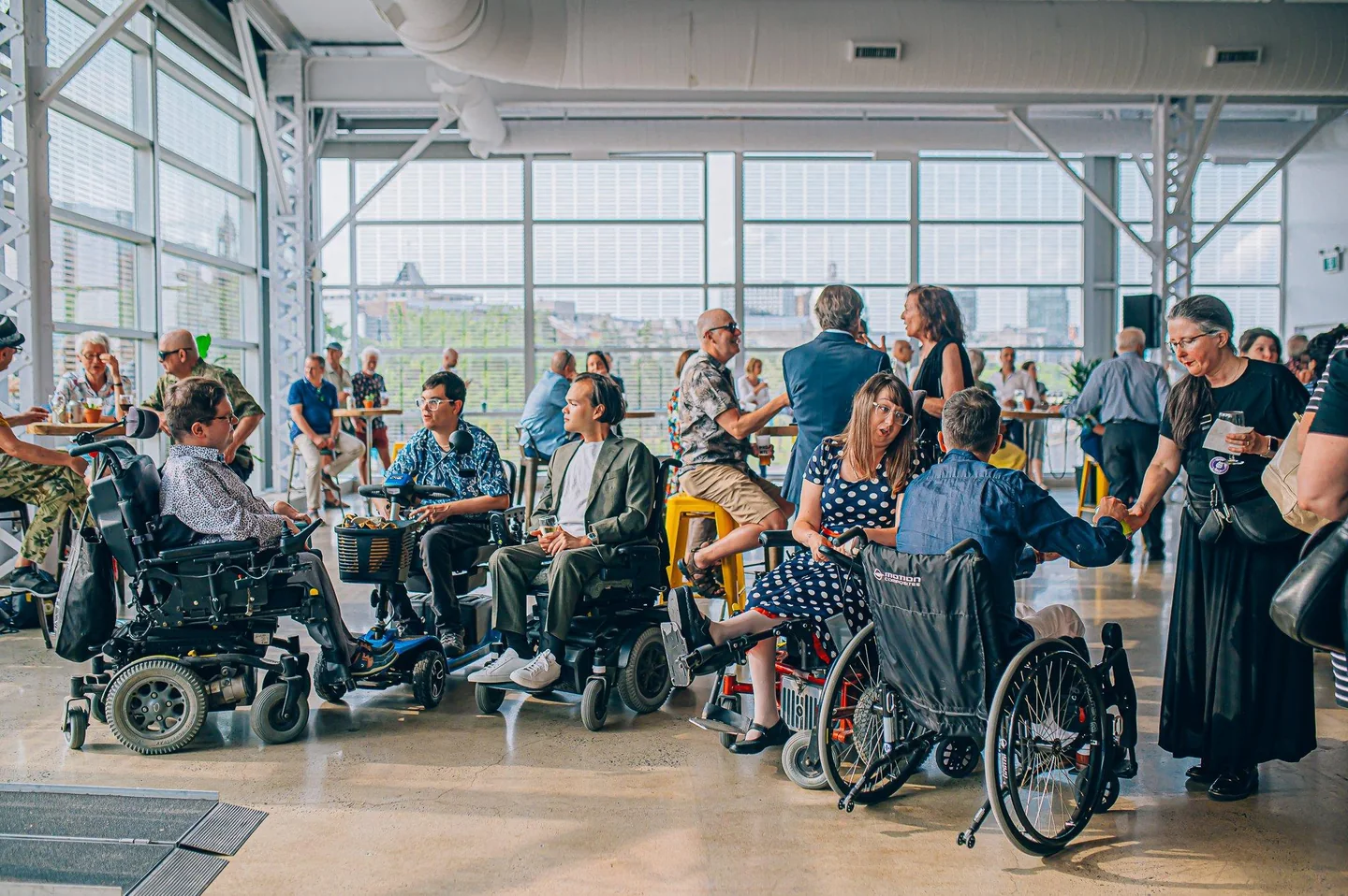 Adults socializing at an accessible community gathering